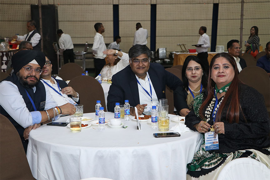 Premium conference setup with rows of chairs and branded podium, Kochi