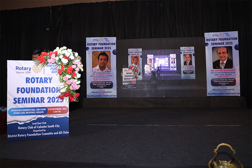Premium conference setup with rows of chairs and branded podium, Kochi
