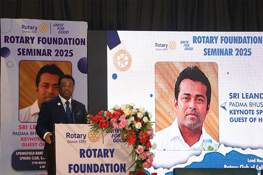 Premium conference setup with rows of chairs and branded podium, Kochi